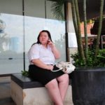 A woman sitting near business center